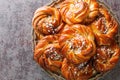 Kanelbullar or Kanelbulle is a traditional Swedish cinnamon buns flavored with cinnamon and cardamom spices and topped with pearl