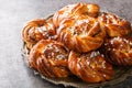 Kanelbullar or Kanelbulle is a traditional Swedish cinnamon buns flavored with cinnamon and cardamom spices and topped with pearl Royalty Free Stock Photo