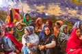 A young bride in a black veil with women at a village wedding in Jammu and Kashmir