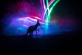 Kangaroo miniature standing at foggy night. Creative table decoration with colorful backlight with fog