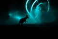 Kangaroo miniature standing at foggy night. Creative table decoration with colorful backlight with fog