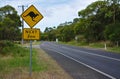 Kangaroo next 2 km sign on street in Australia Royalty Free Stock Photo