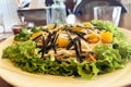 Kani salad with crab, fresh lettuce and mango with vegetables on a plate in a cafe Royalty Free Stock Photo