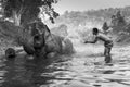 KANJANABURI,THAILAND-JANUARY 30 : Mahout shows playing with an elephant in a river at Sangkhlaburi, Kanjanaburi,Thailand on Januar