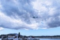 Planes taking off or landing at Kanoni,over the church of Panagia Vlacherna and the Mouse Island on the Greek Island of Corfu. Royalty Free Stock Photo
