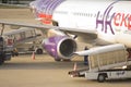 Airplane loading off its passengerst and cargo at Kansai International airport Royalty Free Stock Photo