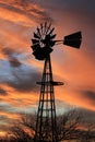 Kansas Awesome Sunset with colorful clouds, and a farm Windmill silhouette .