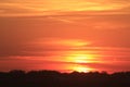 Kansas Blazing Orange Sunset with clouds and the Sun