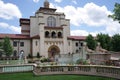 View of rose garden flowers in the background of a historical building in Unity Village, Kansas, USA