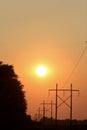 Kansas colorful Smokey Sunset with power lines and a country mail box.