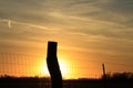 Kansas Sunset with a colorful sky and a fence silhouette