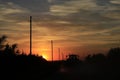 Kansas Sunset with a colorful sky and power lines silhouettes Royalty Free Stock Photo