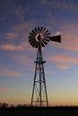 Kansas Windmill at Sunset with a colorful sky with the Sun