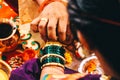 Groom wearing Bracelet With Turmeric Powder to Bride. Kanyadan Ceremony