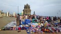 Hawkers selling clothes in the busy street market in the coastal town of