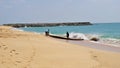 Tamilnadu fishermen getting their wooden boat or catamaran for fishing in Bay of Bengal Royalty Free Stock Photo