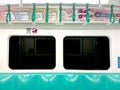 Kaohsiung, Taiwan - February 3, 2024: Kaohsiung Metro (KMRT) train interior seating area, departure station, Royalty Free Stock Photo