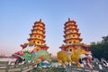 Eople come to merit at Cih Ji Dragon and Tiger Pagodas on lotus pond in sunset time Royalty Free Stock Photo