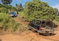 Abandoned truck on Kauai beach being towed