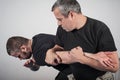 Kapap instructor demonstrates arm bar techniques Royalty Free Stock Photo