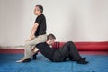 Kapap instructor demonstrates arm lock techniques