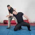 Kapap instructor demonstrates arm lock techniques Royalty Free Stock Photo