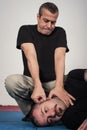 Kapap instructor shows the critical points. Pressure points fighting concept Royalty Free Stock Photo