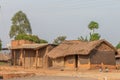 Kapapi / Uganda - Februari 26 2020: Two Ugandan children in ragged clothes playing in front of their houses.