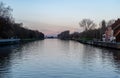 Kapelle op den Bos, Flemish Brabant Region, Belgium - Houses in a row reflecting in the water of the canal at dusk