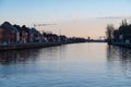 Kapelle op den Bos, Flemish Brabant Region, Belgium - Houses in a row reflecting in the water of the canal at dusk