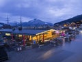 KAPRUN, AUSTRIA, March 13, 2019: Nigt outdoor view on illuminated Kaprun next to cable station with Apres ski restaurant