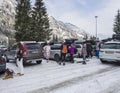 KAPRUN, AUSTRIA, March 12, 2019: Skiers are getting out from cars at parking place at Kitzsteinhorn ski resort and make