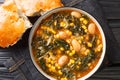 Kara lahana corbasÃÂ± savory cabbage soup with kale, beans and corn close-up in a bowl. Horizontal top view