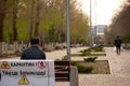 Karaganda, Kazakhstan - 23nd April, 2020 - people violate quarantine and walk on the background of a prohibition sign