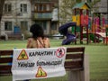 Karaganda, Kazakhstan - 23nd April, 2020 - people violate quarantine and walk on the background of a prohibition sign