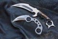 Karambit knives designer made, on a worn leather black jacket