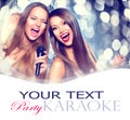 Karaoke. Beauty girls with a microphone Royalty Free Stock Photo