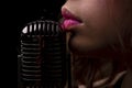 Karaoke. Closeup lip with vintage microphone. Sensual woman singer. Concert singing. Royalty Free Stock Photo