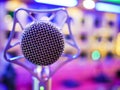 Karaoke dynamic microphone on colorful background in the club close up Royalty Free Stock Photo
