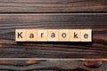 Karaoke word written on wood block. karaoke text on table, concept Royalty Free Stock Photo