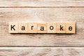 Karaoke word written on wood block. karaoke text on table, concept Royalty Free Stock Photo