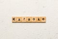 karaoke word written on wood block. karaoke text on table, concept Royalty Free Stock Photo