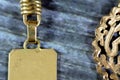 Karat 18 gold stamp closeup view from golden keyring medal connected with a chain, savings, gold exchange rate marketing and value