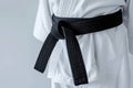 Karate black belt on white uniform