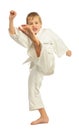 Karate boy kicking by left leg