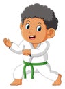The karate boy is ready for fighting and attack the enemy Royalty Free Stock Photo
