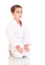 Karate boy sitting in white kimono Royalty Free Stock Photo