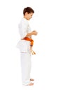 Karate boy smiling isolated on white Royalty Free Stock Photo