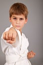 Karate boy in white kimono fighting Royalty Free Stock Photo