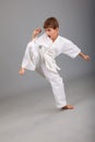 Karate boy in white kimono fighting Royalty Free Stock Photo